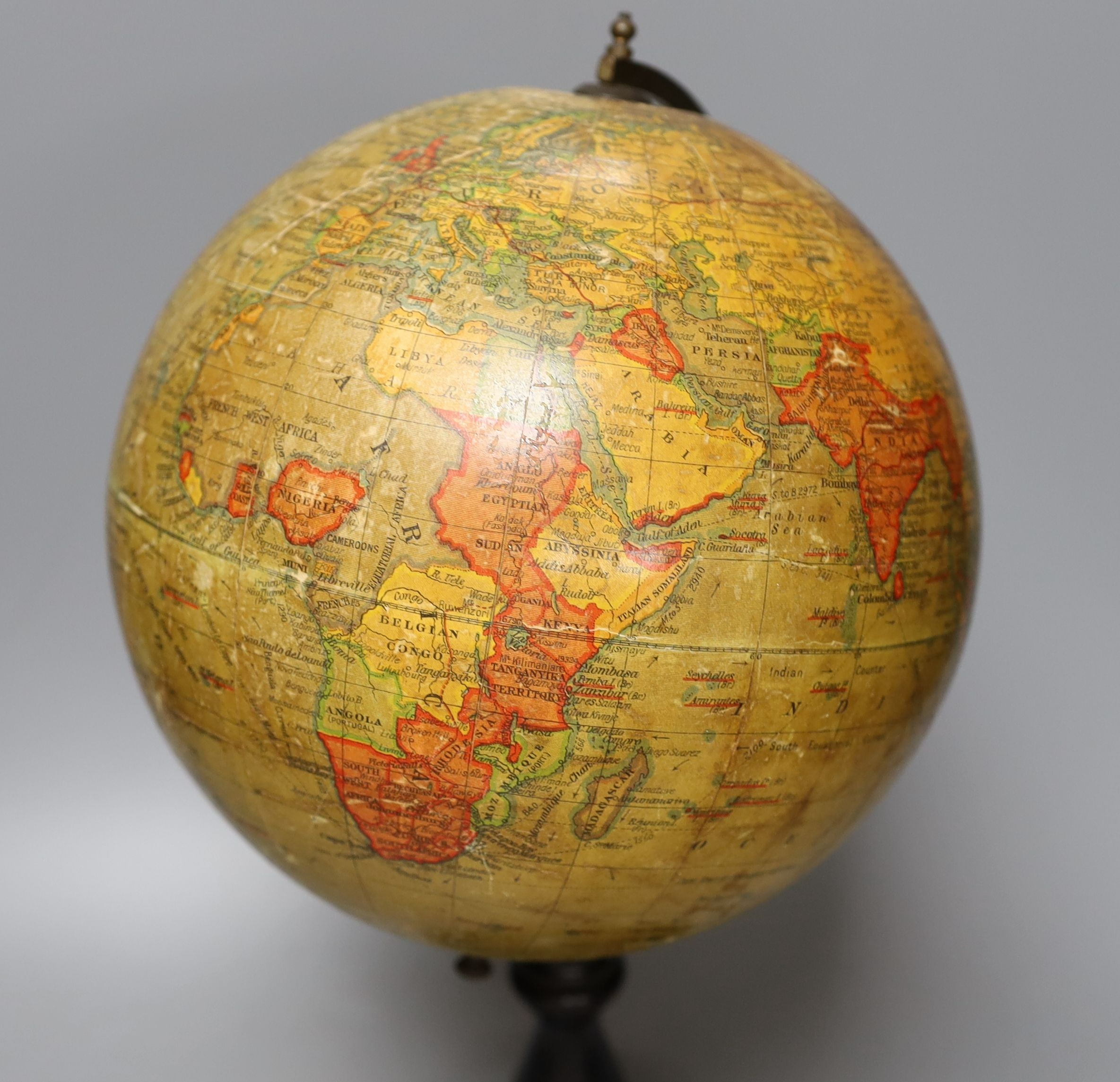 A Geographia 8 inch terrestrial globe, ebonised stand. 37cm tall